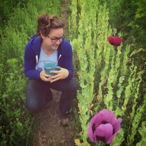 Lennie admiring the first of the poppy blooms at B-Side Farm