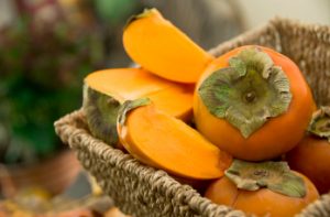 persimmons in basket